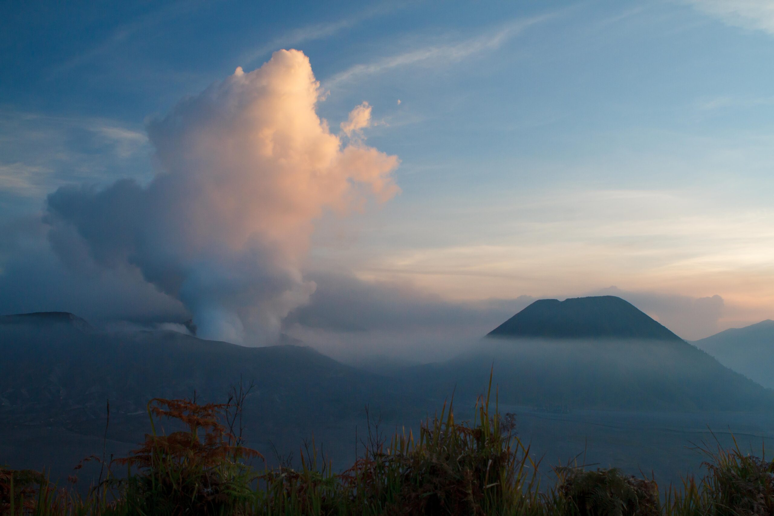 Active volcano Mount Bromo releasing steam in East Java, Indonesia