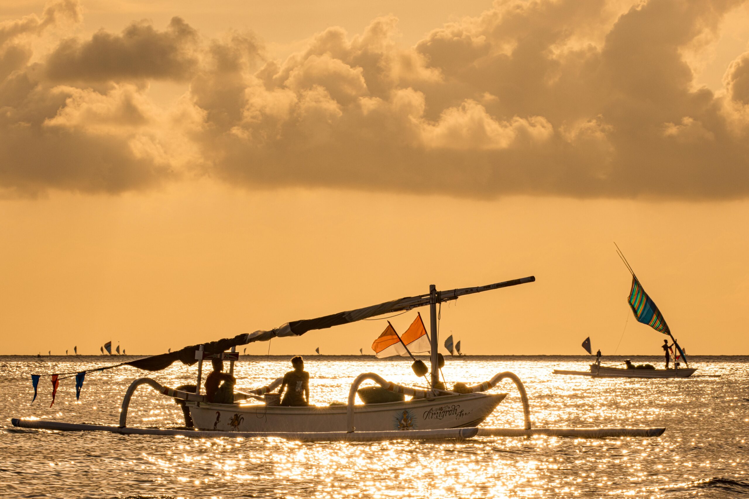 Traditional jukung fishing boat at sunrise near Amed, Northeast Bali